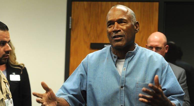 O.J. Simpson reacts after learning he was granted parole at Lovelock Correctional Center.
