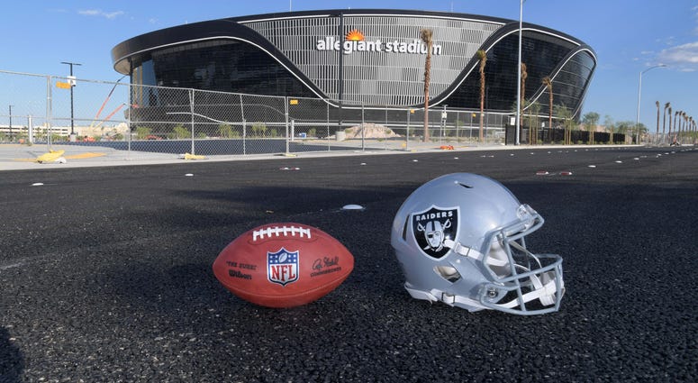 General overall aerial view of Las Vegas Raiders helmet and Wilson 2020 NFL The Duke official football at the Allegiant Stadium construction site.
