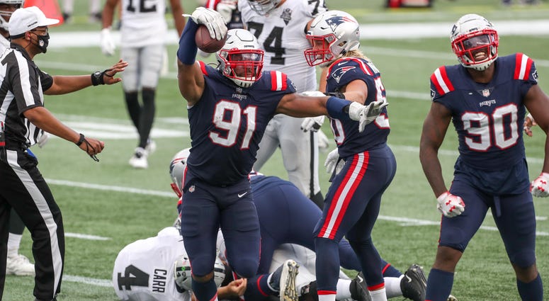 New England Patriots defensive end Deatrich Wise (91) recovers a fumble for a touchdown during the second half against the Las Vegas Raiders at Gillette Stadium