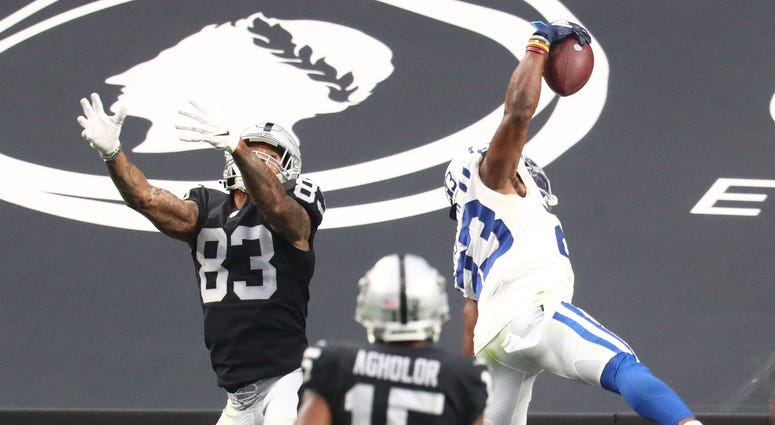 Indianapolis Colts cornerback Kenny Moore II (23) makes a one handed interception catch against Las Vegas Raiders tight end Darren Waller (83) at Allegiant Stadium.