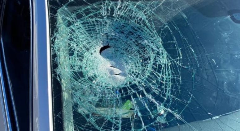 Broken windshield from rock throwing incident