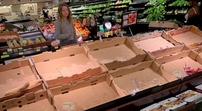 Shot of frustrated shopper and empty shelves