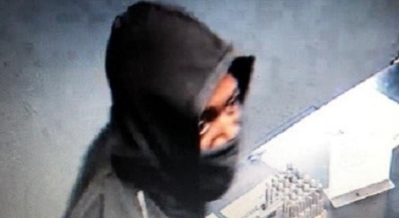 Surveillance snapshot of gun store robbery suspect