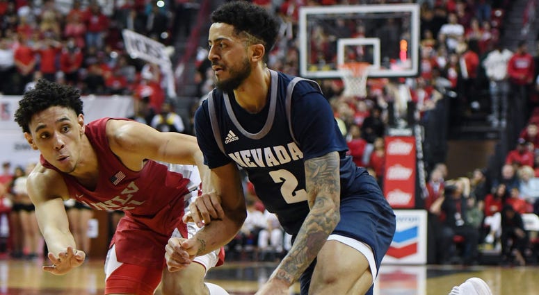 Jalen Harris #2 of the Nevada Wolf Pack drives to the basket against Marvin Coleman #31 of the UNLV Rebels during their game at the Thomas & Mack Center on February 12, 2020