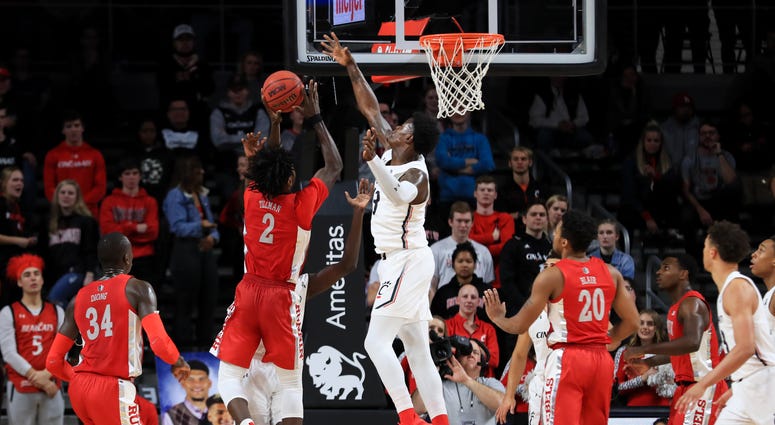 UNLV Rebels forward Donnie Tillman (2) drives to the basket against Cincinnati Bearcats forward Tre Scott (13) in the first game at Fifth Third Arena.