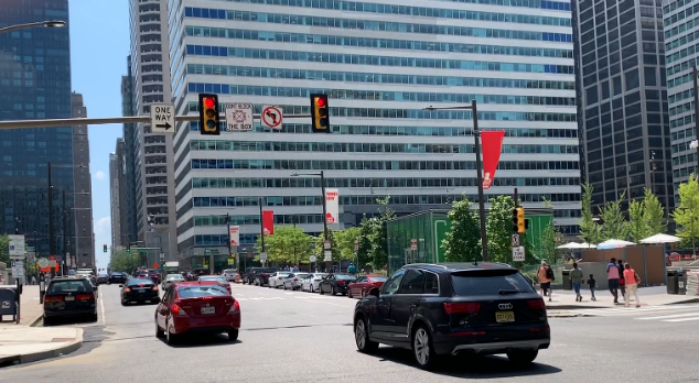 Cars running through a red light in Center City. Cars running through a red light in Center City.