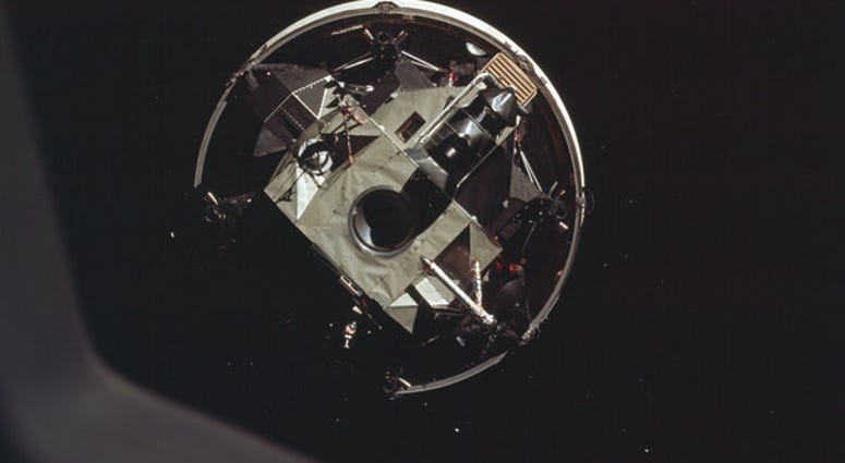 The Apollo 11 crew docks head-first with the moon landing module. The Apollo 11 crew docks head-first with the moon landing module.