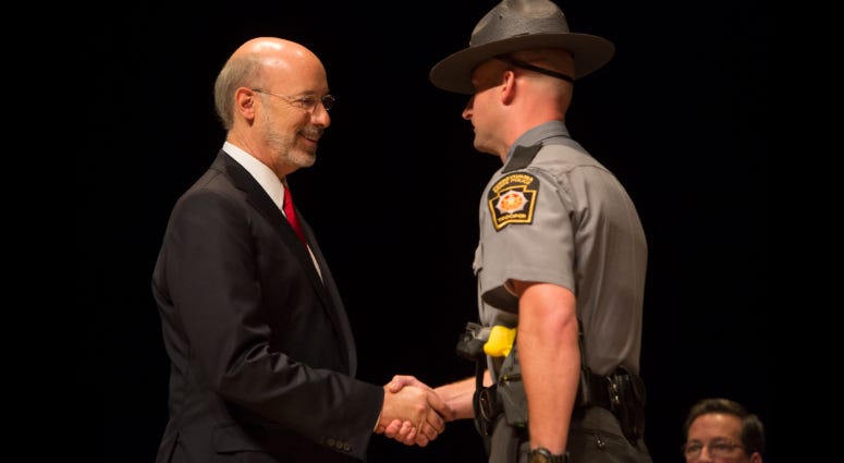 Gov. Tom Wolf shakes the hand of a graduate of the Pennsylvania State Police 142nd Cadet Class, Sept. 4, 2015. Gov. Tom Wolf