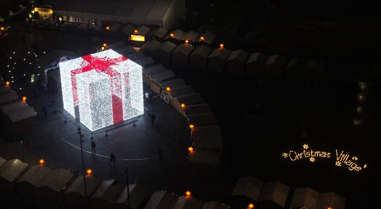 A 27-foot-tall Christmas present sits in the middle of the Christmas Village in LOVE Park. A 27-foot-tall Christmas present sits in the middle of the Christmas Village in LOVE Park.