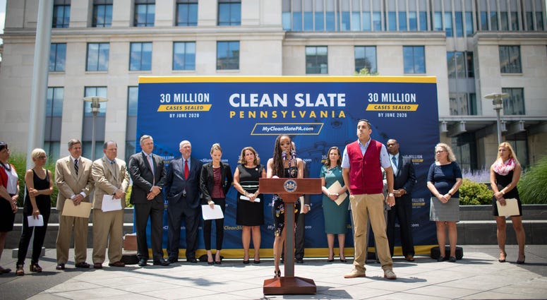 Marilyn (center), who benefits from the Clean Slate law, speaks at a press conference June 28, 2019 in Harrisburg with Gov. Tom Wolf, celebrating the anniversary of Clean Slate becoming law. They plan to seal 30 million criminal records by June 2020. Clean Slate press conference