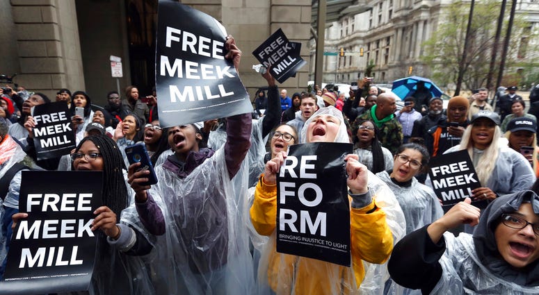 Protesters demonstrate in front of a courthouse during a hearing for rapper Meek Mill. Protesters demonstrate in front of a courthouse during a hearing for rapper Meek Mill.