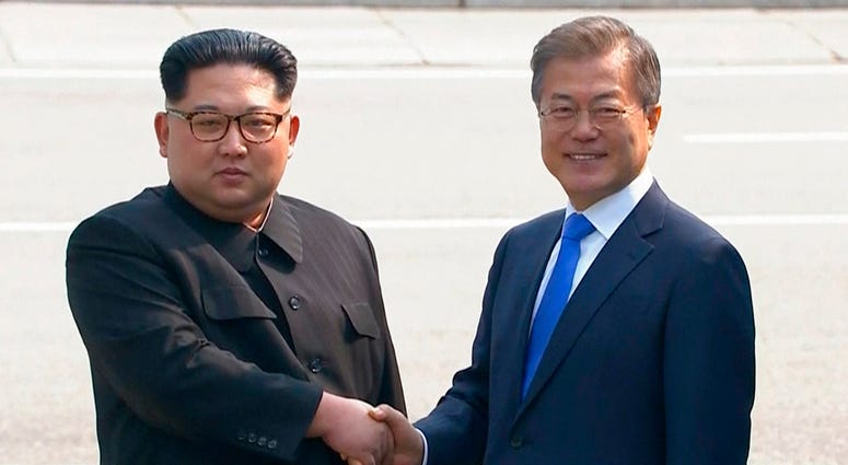 North Korean leader Kim Jong Un, left, shakes hands with South Korean President Moon Jae-in as Kim crossed the border into South Korea. North Korean leader Kim Jong Un, left, shakes hands with South Korean President Moon Jae-in as Kim crossed the border into South Korea.