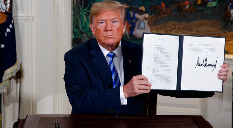 President Donald Trump shows a signed Presidential Memorandum after delivering a statement on the Iran nuclear deal from the Diplomatic Reception Room of the White House. President Donald Trump shows a signed Presidential Memorandum after delivering a statement on the Iran nuclear deal from the Diplomatic Reception Room of the White House.