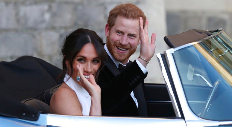 The newly married Duke and Duchess of Sussex, Meghan Markle and Prince Harry, leave Windsor Castle in a convertible car after their wedding. Meghan Markle and Prince Harry