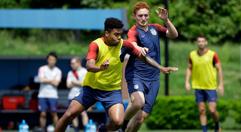 United States' Weston McKennie, left, and Josh Sargent battle for the ball during soccer practice at the University of Pennsylvania. United States' Weston McKennie, left, and Josh Sargent battle for the ball during soccer practice at the University of Pennsylvania.