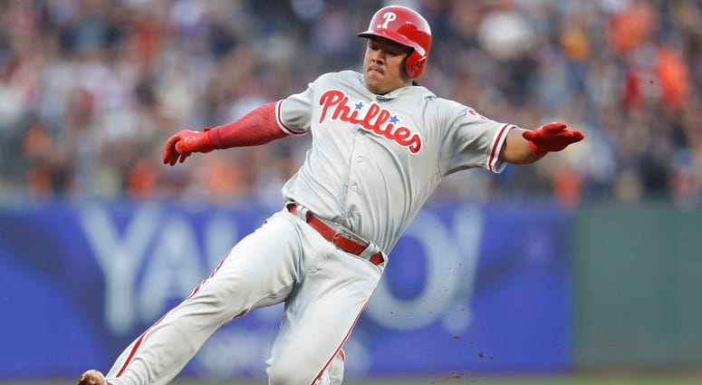 Philadelphia Phillies' Jorge Alfaro slides safely into third base with a triple during the third inning of a baseball game against the San Francisco Giants. Philadelphia Phillies' Jorge Alfaro slides safely into third base with a triple during the third inning of a baseball game against the San Francisco Giants.