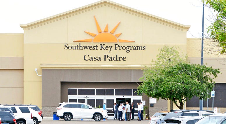 In this June 18, 2018 file photo, dignitaries take a tour of Southwest Key Programs Casa Padre, a U.S. immigration facility in Brownsville, Texas, where children who have been separated from their families are detained. In this June 18, 2018 file photo, dignitaries take a tour of Southwest Key Programs Casa Padre, a U.S. immigration facility in Brownsville, Texas, where children who have been separated from their families are detained.