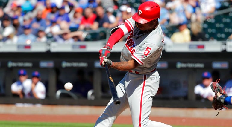 Philadelphia Phillies' Nick Williams (5) hits an RBI-single during the first inning in the first game of a baseball doubleheader against the New York Mets, Monday, July 9, 2018, in New York. Philadelphia Phillies' Nick Williams (5) hits an RBI-single during the first inning in the first game of a baseball doubleheader against the New York Mets, Monday, July 9, 2018, in New York.