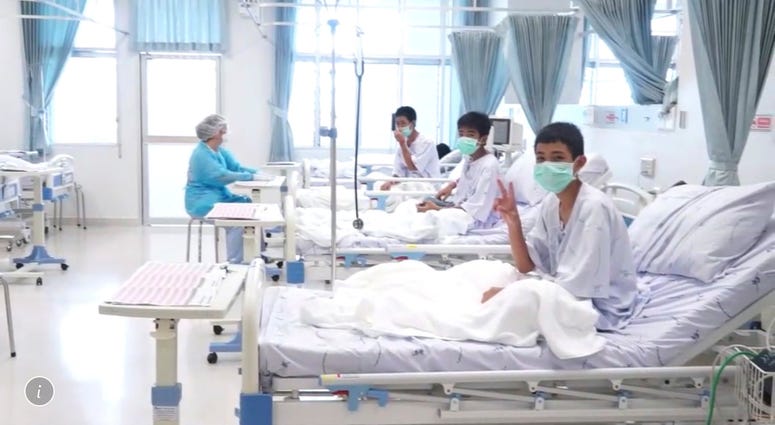 Three of the 12 boys are seen recovering in their hospital beds after being rescued along with their coach from a flooded cave in Mae Sai, Chiang Rai province, northern Thailand. Three of the 12 boys are seen recovering in their hospital beds after being rescued along with their coach from a flooded cave in Mae Sai, Chiang Rai province, northern Thailand.