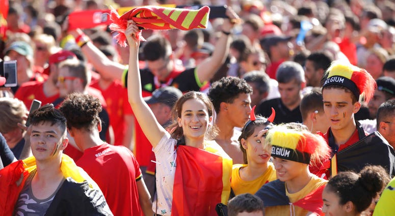 Belgium soccer fan reacts as they watch a 2018 World Cup soccer match between Belgium and England on a giant screen in Jette, Belgium. Belgium soccer fan reacts as they watch a 2018 World Cup soccer match between Belgium and England on a giant screen in Jette, Belgium.