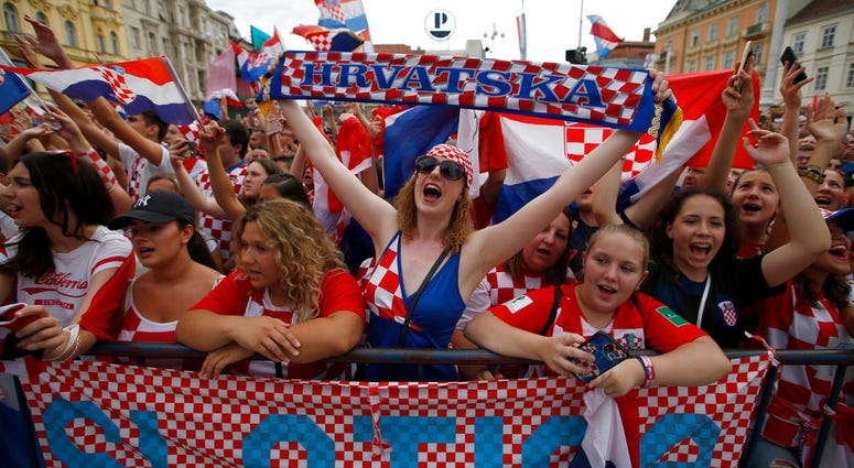 Supporter of Croatia national soccer team members wait to welcome the team on their arrival in Zagreb, Croatia. Supporter of Croatia national soccer team members wait to welcome the team on their arrival in Zagreb, Croatia.