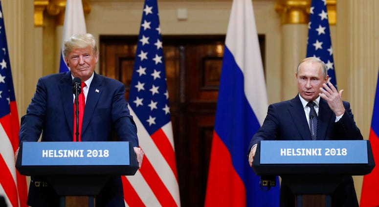 U.S. President Donald Trump, left, listens to Russian President Vladimir Putin during a press conference after their meeting at the Presidential Palace in Helsinki, Finland. U.S. President Donald Trump, left, listens to Russian President Vladimir Putin during a press conference after their meeting at the Presidential Palace in Helsinki, Finland.
