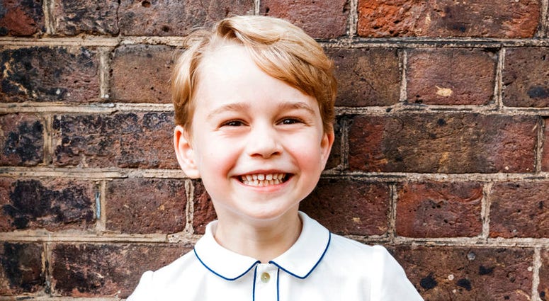 In this photo taken on Monday, July 9, 2018, Britain's Prince George poses for a picture following the christening of his brother Prince Louis, at Clarence House in London. Prince George