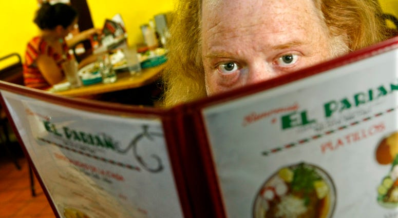 In this June 7, 2010 photo, Jonathan Gold, a food critic for L.A. Weekly, poses for a portrait at El Parian Restaurant in Los Angeles. Jonathan Gold