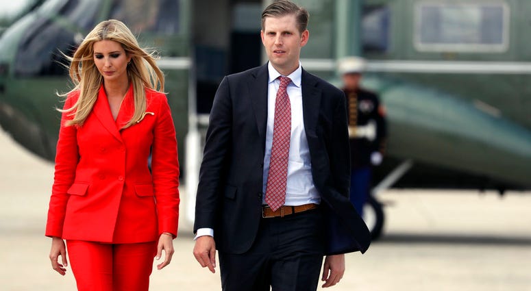 Ivanka Trump, the daughter of President Donald Trump, left walks Eric Trump, son of President Donald Trump, as they walk to board Air Force One with President Donald Trump for a trip to Tampa, Fla., to attend a campaign rally, Tuesday, July 31, 2018. Ivanka and Eric Trump