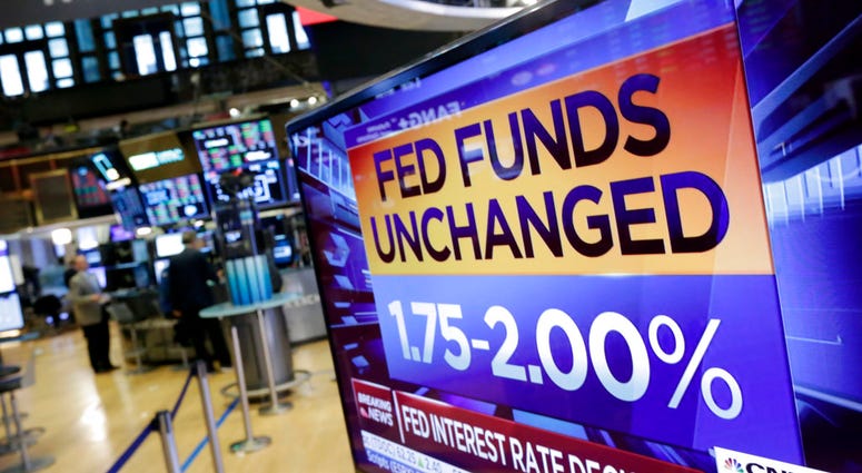 A screen on the floor of the New York Stock Exchange shows the rate decision of the Federal Reserve, Wednesday, Aug. 1, 2018. A screen on the floor of the New York Stock Exchange shows the rate decision of the Federal Reserve, Wednesday, Aug. 1, 2018.