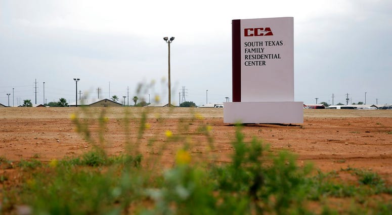 This June 30, 2015 file photo shows a sign at the entrance to the South Texas Family Residential Center in Dilley, Texas. This June 30, 2015 file photo shows a sign at the entrance to the South Texas Family Residential Center in Dilley, Texas.