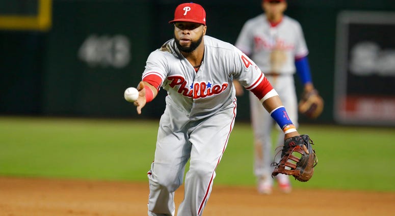 Philadelphia Phillies first baseman Carlos Santana flips the ball for an out on a ball hit by Arizona Diamondbacks' Paul Goldschmidt in the fourth inning. Philadelphia Phillies first baseman Carlos Santana flips the ball for an out on a ball hit by Arizona Diamondbacks' Paul Goldschmidt in the fourth inning.