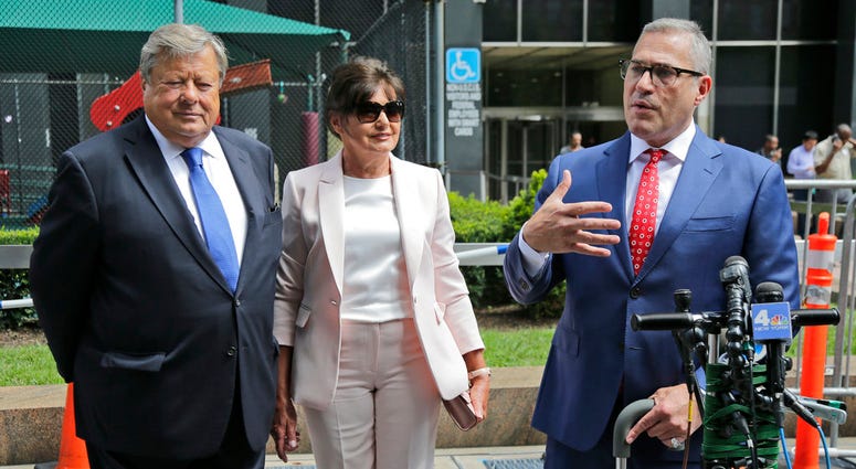 Viktor, left, and Amalija Knavs listen as their attorney Michael Wildes, right, makes a statement in New York, Thursday, Aug. 9, 2018. Viktor, left, and Amalija Knavs listen as their attorney Michael Wildes, right, makes a statement in New York, Thursday, Aug. 9, 2018.