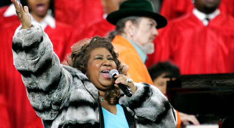 Aretha Franklin and Dr. John, background on piano, perform the national anthem before the Super Bowl XL football game in Detroit. Aretha Franklin