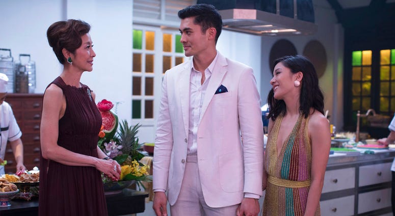 This image released by Warner Bros. Entertainment shows Michelle Yeoh, from left, Henry Golding and Constance Wu in a scene from the film "Crazy Rich Asians." "Crazy Rich Asians"