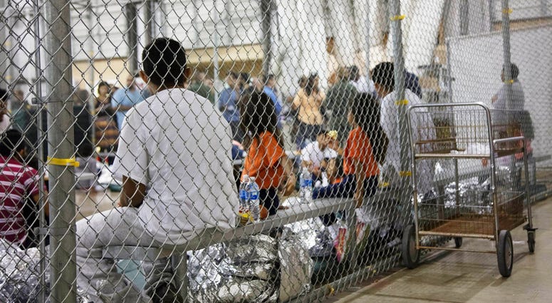In this June 17, 2018 file photo provided by U.S. Customs and Border Protection, people who've been taken into custody related to cases of illegal entry into the United States, sit in one of the cages at a facility in McAllen, Texas. In this June 17, 2018 file photo provided by U.S. Customs and Border Protection, people who've been taken into custody related to cases of illegal entry into the United States, sit in one of the cages at a facility in McAllen, Texas.