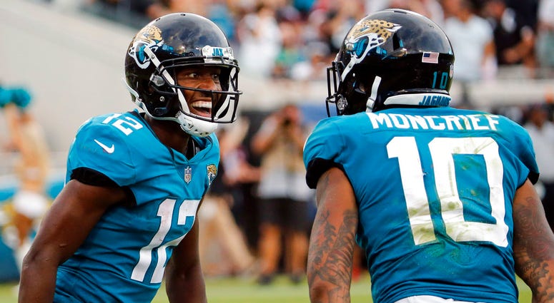 Jacksonville Jaguars wide receiver Dede Westbrook (12) celebrates his 61-yard touchdown against the New England Patriots with teammate wide receiver Donte Moncrief (10) during the second half, Sunday, Sept. 16, 2018, in Jacksonville, Fla. Jacksonville Jaguars wide receiver Dede Westbrook (12) celebrates his 61-yard touchdown against the New England Patriots with teammate wide receiver Donte Moncrief (10) during the second half, Sunday, Sept. 16, 2018, in Jacksonville, Fla.
