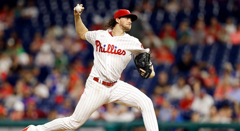 Philadelphia Phillies' Aaron Nola pitches during the second inning of the team's baseball game against the New York Mets, Tuesday, Sept. 18, 2018, in Philadelphia. Philadelphia Phillies' Aaron Nola