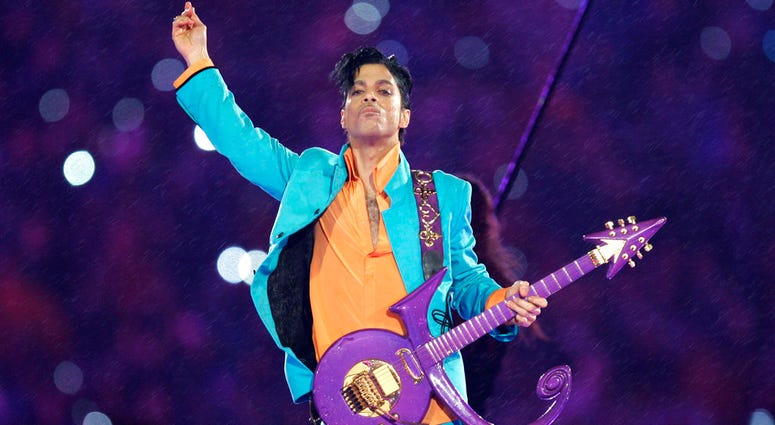 In this Feb. 4, 2007, file photo, Prince performs during the halftime show at the Super Bowl XLI football game at Dolphin Stadium in Miami. Prince