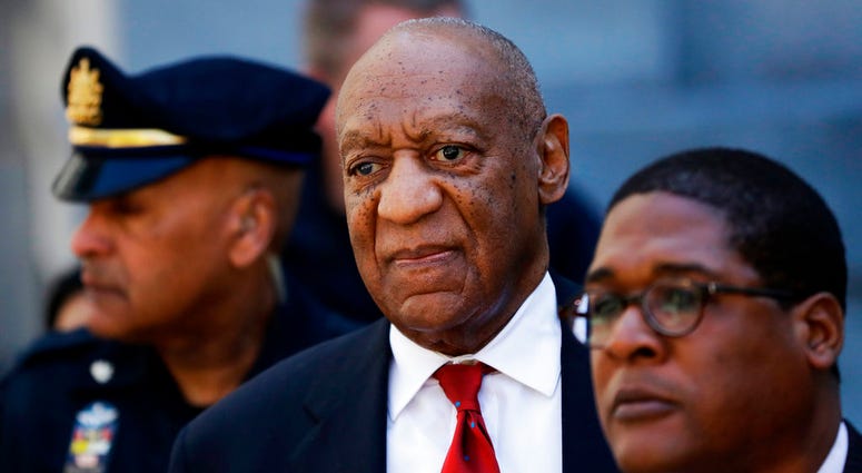 In this April 26, 2018, file photo, Bill Cosby, center, leaves the the Montgomery County Courthouse in Norristown, Pa. Bill Cosby