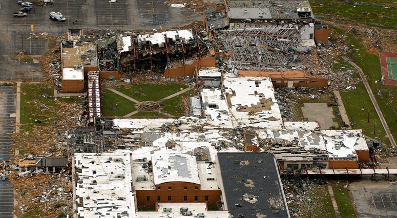 This May 24, 2011, file photo shows the damage to Joplin High School in Joplin, Mo., after a tornado swept through the area. Hurricane Florence