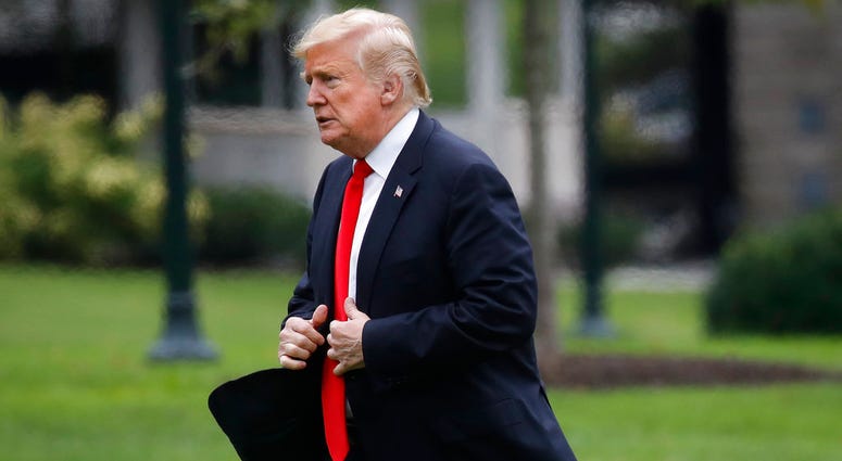 President Donald Trump walks across the South Lawn on return from New York City, Thursday, Sept. 27, 2018, at the White House in Washington. President Donald Trump walks across the South Lawn on return from New York City, Thursday, Sept. 27, 2018, at the White House in Washington.