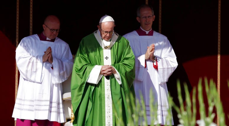 Pope Francis, center, celebrates a Mass for the opening of a synod, a meeting of bishops, in St. Peter's Square, at the Vatican, Wednesday, Oct. 3, 2018. Pope Francis