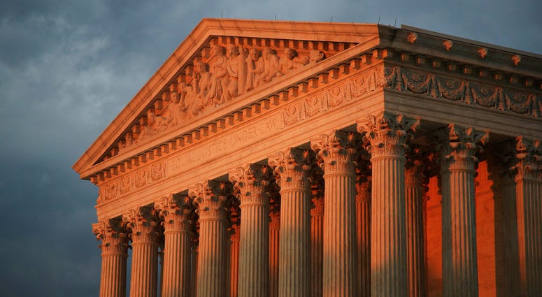 The U.S. Supreme Court is seen at sunset in Washington, Thursday, Oct. 4, 2018. U.S. Supreme Court