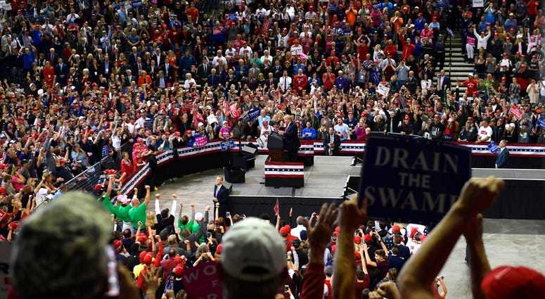 President Donald Trump speaks at a rally in Council Bluffs, Iowa, Tuesday, Oct. 9, 2018.