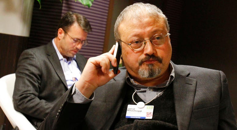Saudi journalist Jamal Khashoggi speaks on his cellphone at the World Economic Forum in Davos, Switzerland. Jamal Khashoggi