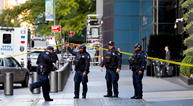 New York City Police Dept. officers arrive outside the Time Warner Center, in New York, Wednesday, Oct. 24, 2018. A police bomb squad was sent to CNN's offices in New York City and the newsroom was evacuated because of a suspicious package. (AP Photo/Rich Pipe bombs target Democrats
