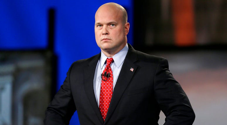In this April 24, 2014, file photo, then-Iowa Republican senatorial candidate and former U.S. Attorney Matt Whitaker watches before a live televised debate in Johnston, Iowa. Matthew Whitaker
