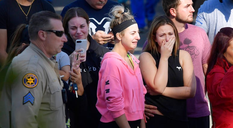 People cry as a law enforcement motorcade escorts the body of Ventura County Sheriff's Department Sgt. Ron Helus from the Los Robles Regional Medical Center. People cry as a law enforcement motorcade escorts the body of Ventura County Sheriff's Department Sgt. Ron Helus from the Los Robles Regional Medical Center.