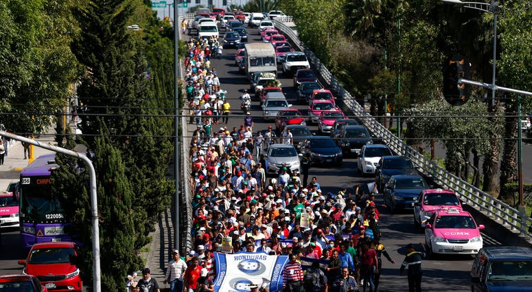 A group of Central American migrants, representing the thousands participating in a caravan trying to reach the U.S. border, undertake an hours-long march to the office of the United Nations' humans rights body in Mexico City, Thursday, Nov. 8, 2018. A group of Central American migrants, representing the thousands participating in a caravan trying to reach the U.S. border, undertake an hours-long march to the office of the United Nations' humans rights body in Mexico City, Thursday, Nov. 8, 2018.